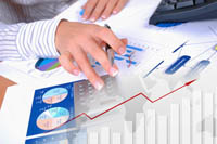 Hands working on charts
